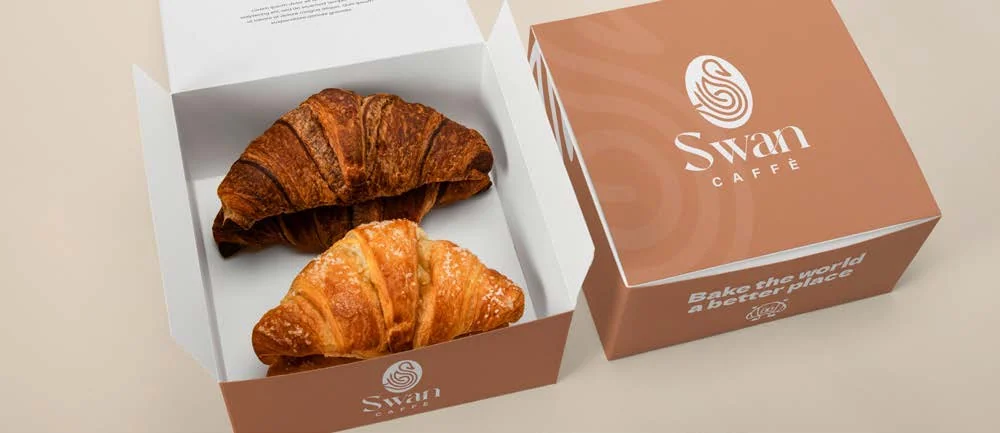 Swan Café branded pastry box with croissants